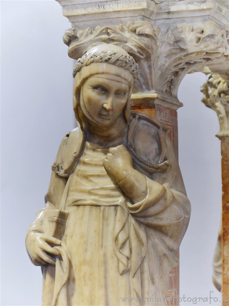 Milan (Italy) - Allegory of obedience at the base of the Ark of San Peter Martyr in the Portinari Chapel